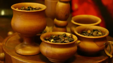 Coffee beans displayed in wooden cups in George Town